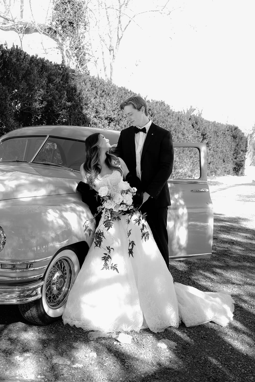 Wedding chauffeur Richmond VA — editorial black and white portrait with 1949 Packard vintage car